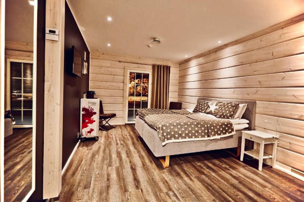 Postel nebo postele na pokoji v ubytování Lapland Lodge
