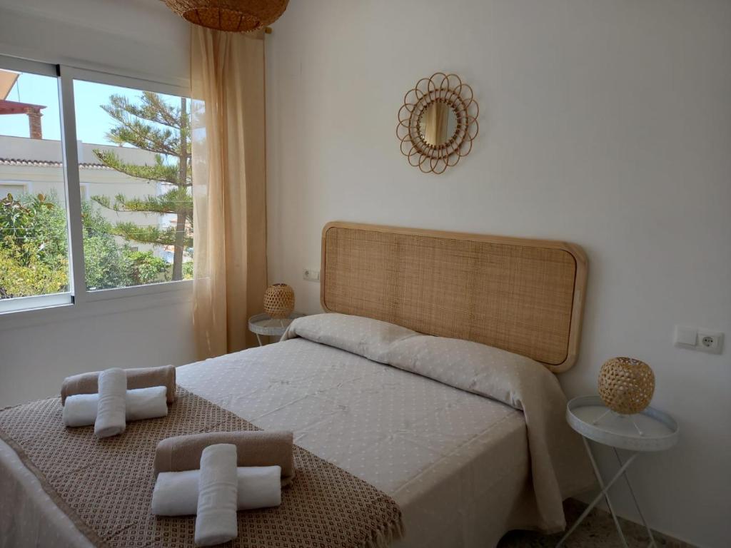 Postel nebo postele na pokoji v ubytování Villa El Algarrobo