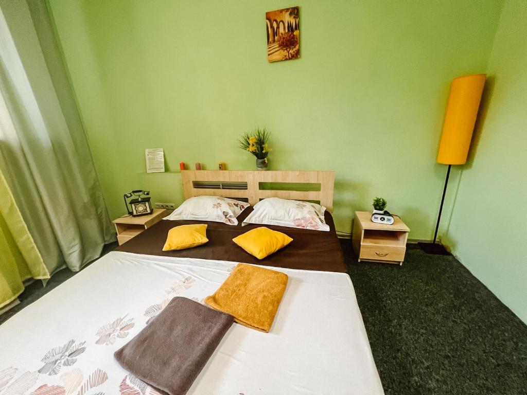 Postel nebo postele na pokoji v ubytování Mini Hotel near Arena City