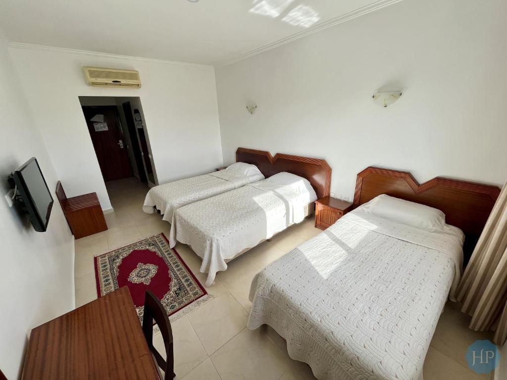 Postel nebo postele na pokoji v ubytování Hôtel Plaisance