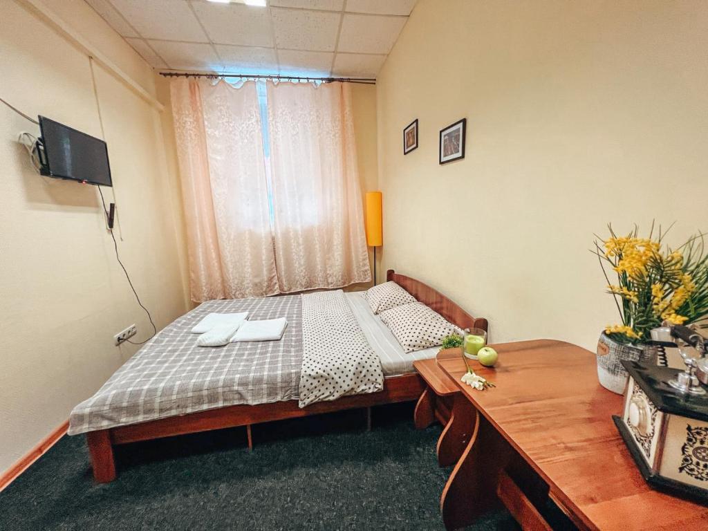 Postel nebo postele na pokoji v ubytování Mini Hotel near Arena City