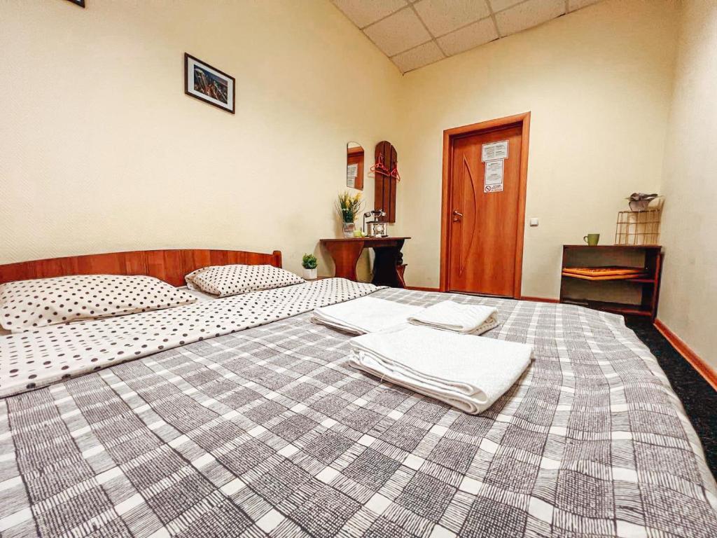 Postel nebo postele na pokoji v ubytování Mini Hotel near Arena City