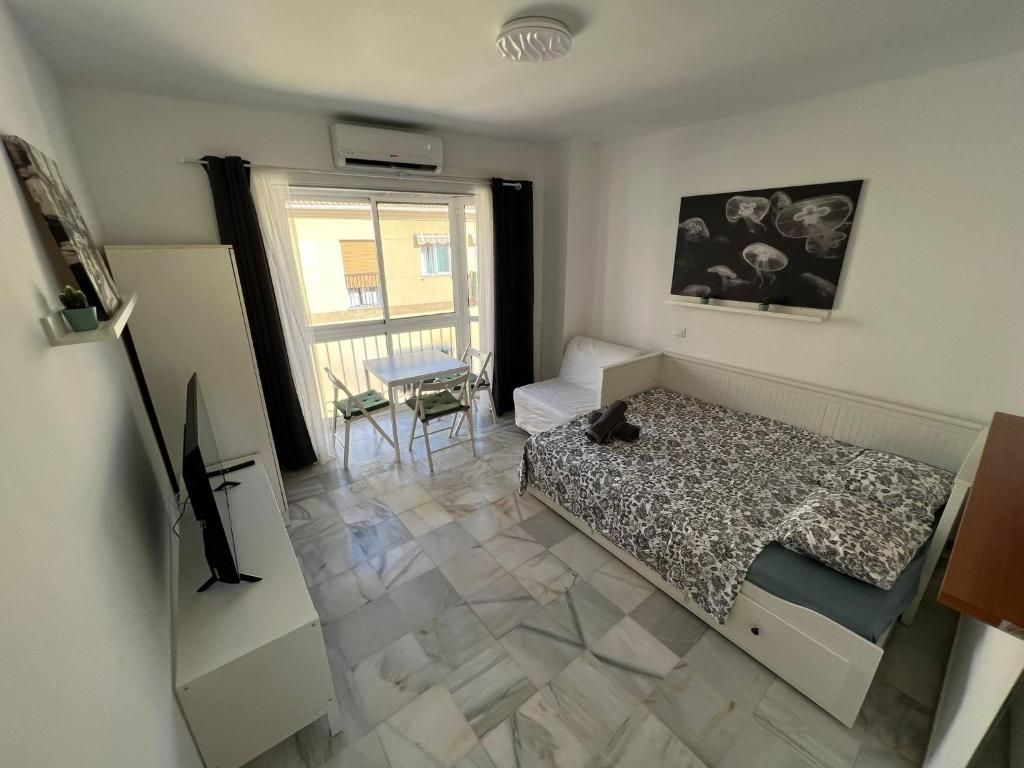 Posteľ alebo postele v izbe v ubytovaní Genuar Apartments Málaga Center 3