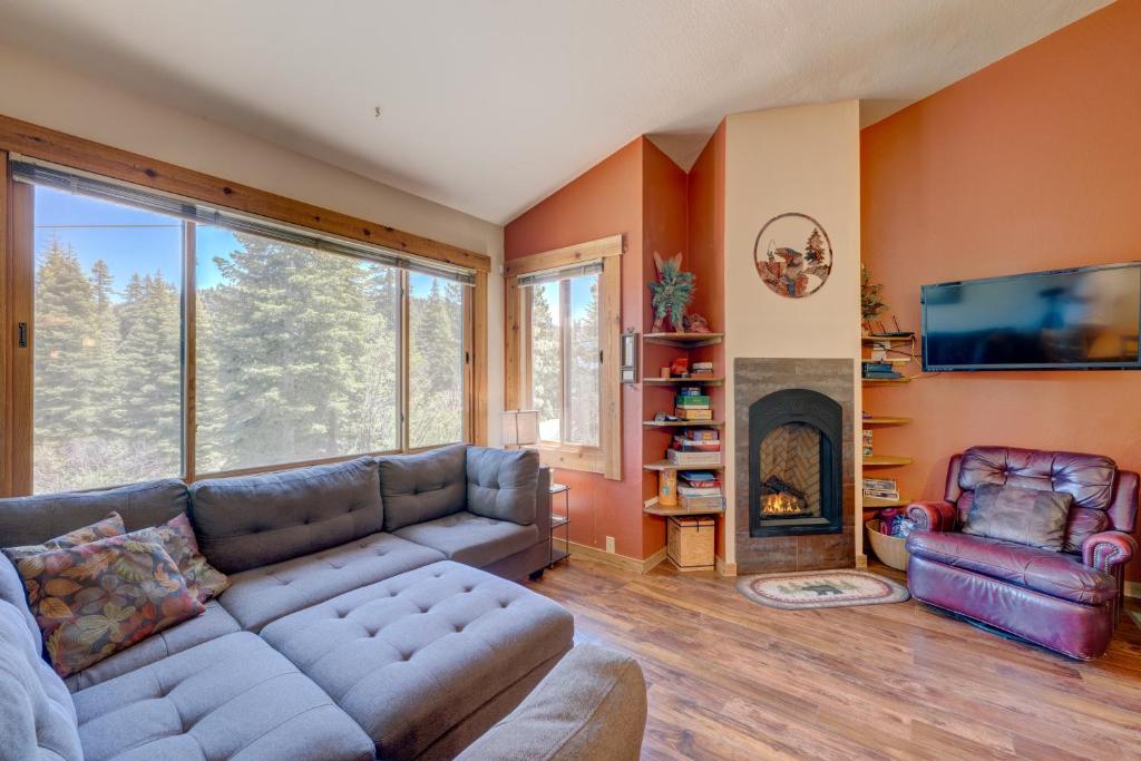a living room with a couch and a fireplace at Make Way for the Mountains in Truckee