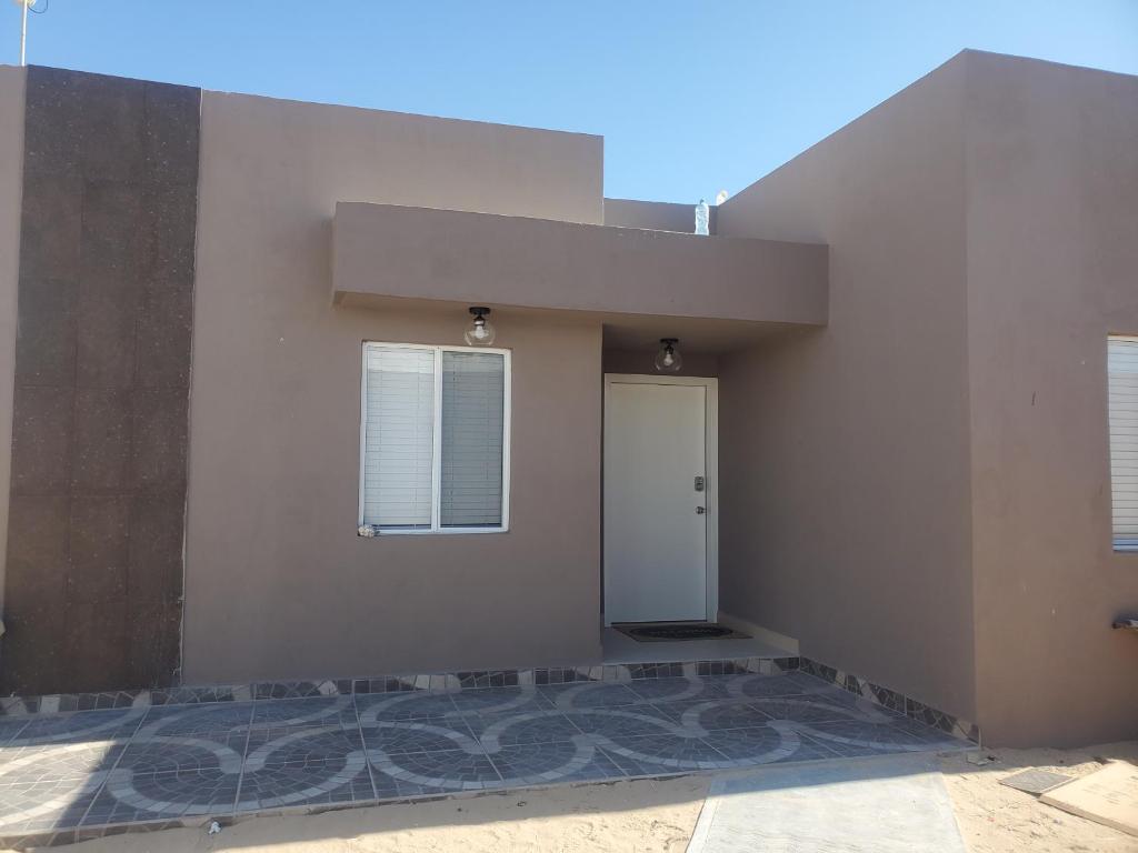 a building with a door on the side of it at Sofia apartment in Puerto Peñasco
