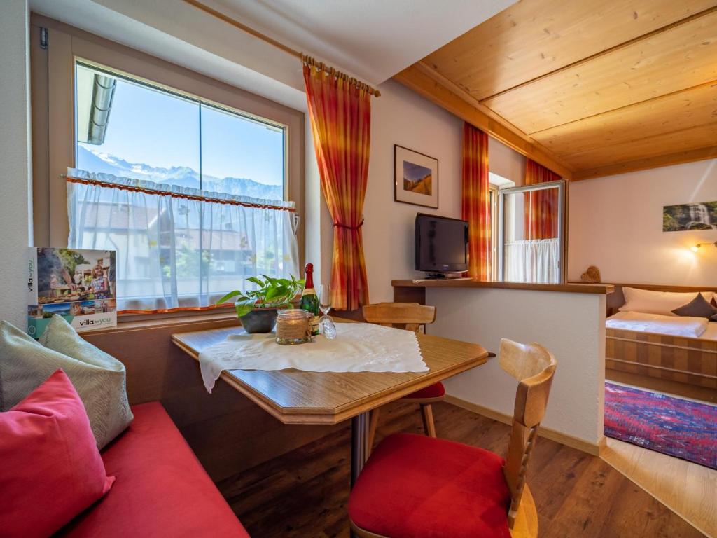 Televízia a/alebo spoločenská miestnosť v ubytovaní Panorama II