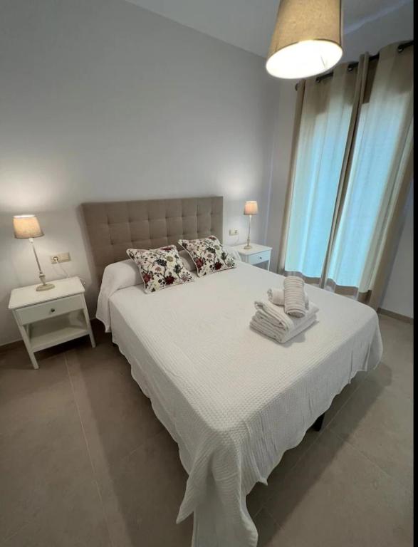 Postel nebo postele na pokoji v ubytování Apartamento La Canela