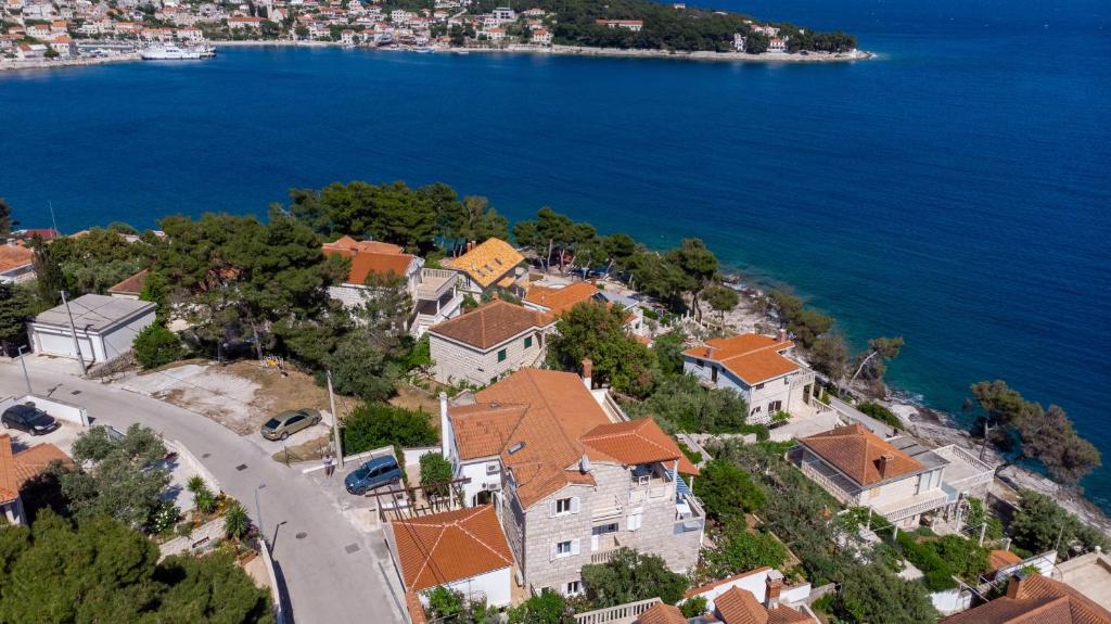 an aerial view of a house by the water at Apartments by the sea Puntinak, Brac - 718 in Selca