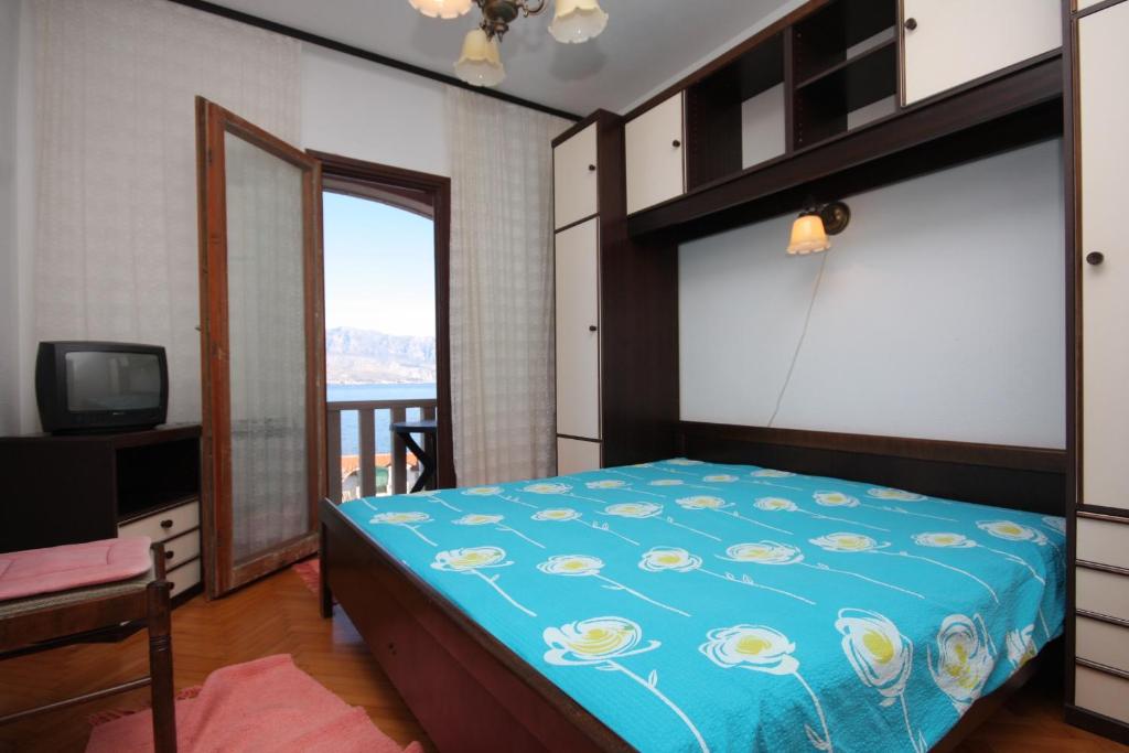 Posteľ alebo postele v izbe v ubytovaní Apartment Postira 740b