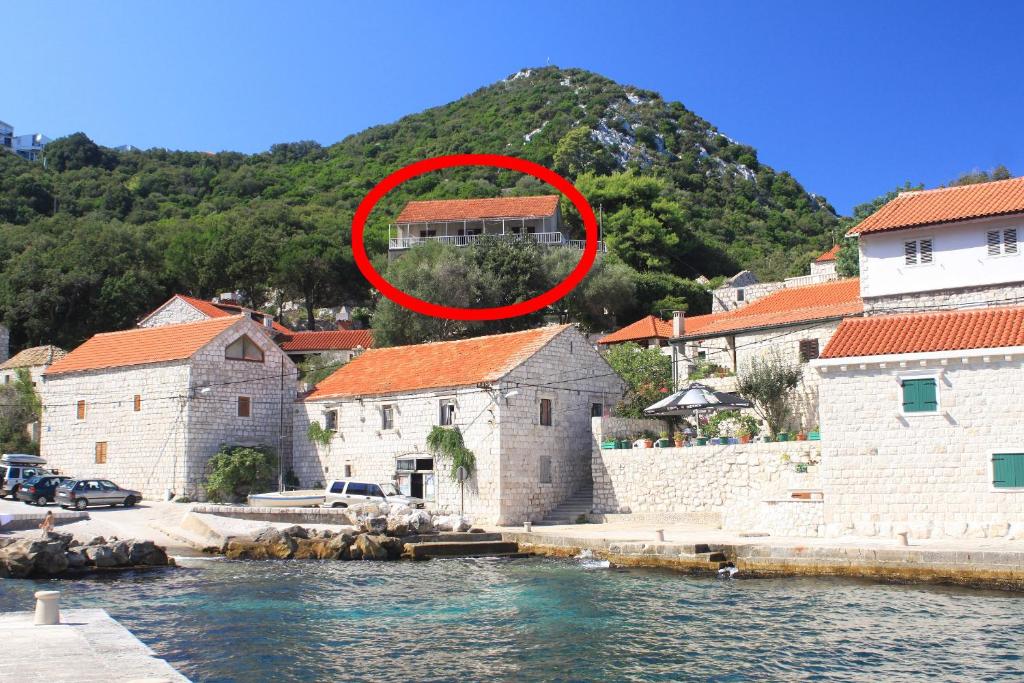a red circle in the middle of a group of buildings at Double Room Lucica 990a in Lastovo