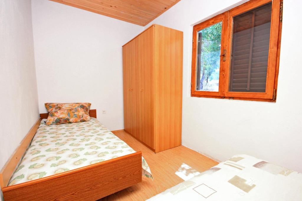 Postel nebo postele na pokoji v ubytování Apartment Zman 887c