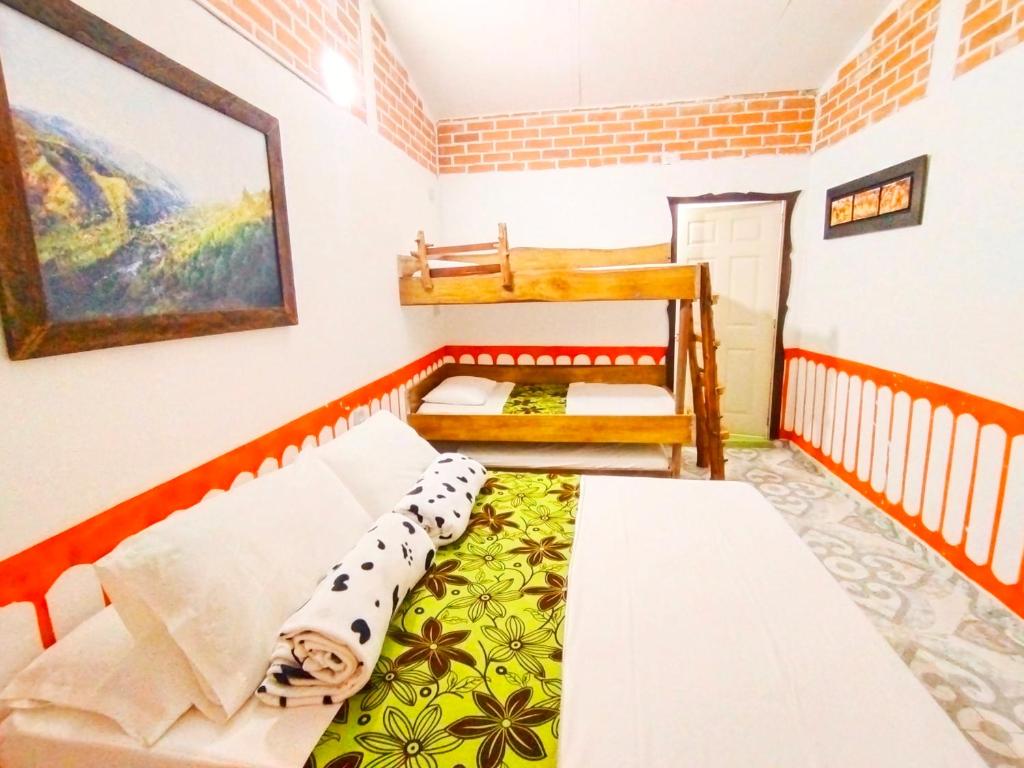 Cama o camas de una habitación en Casa Turística Art-Vélez Salento