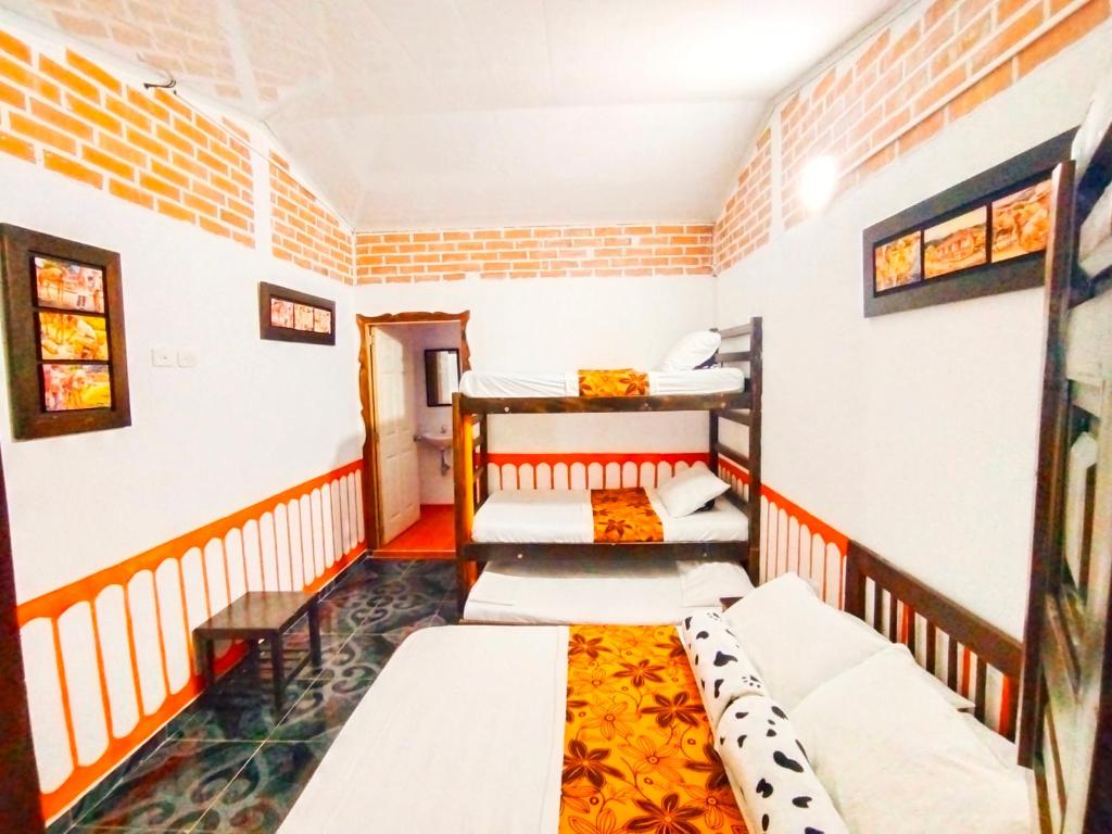 Cama o camas de una habitación en Casa Turística Art-Vélez Salento