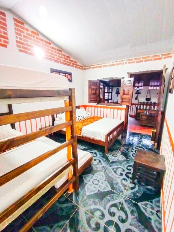 Cama o camas de una habitación en Casa Turística Art-Vélez Salento