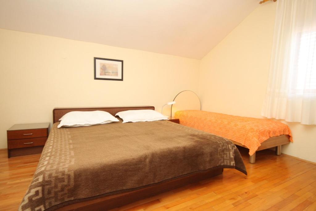 Posteľ alebo postele v izbe v ubytovaní Apartment Sali 872a