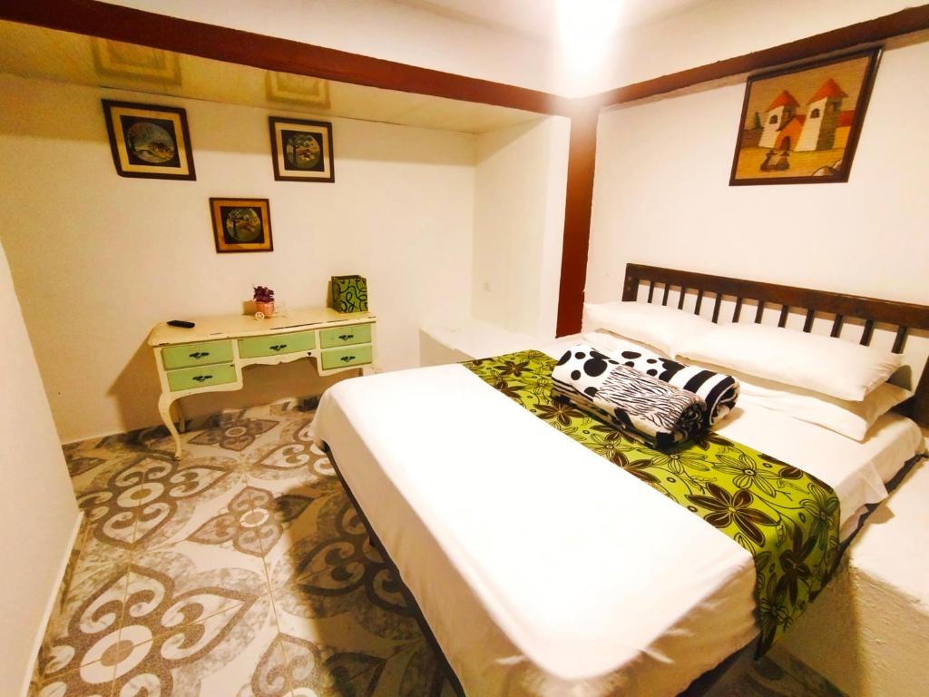 Cama o camas de una habitación en Casa Turística Art-Vélez Salento