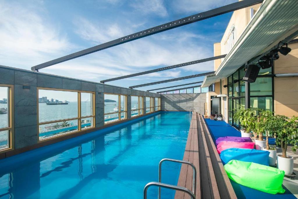 a swimming pool on the top of a building at Hotel Wolmido in Incheon