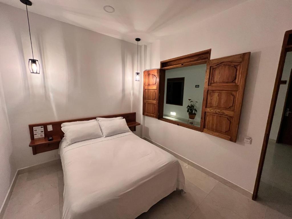 Postel nebo postele na pokoji v ubytování Casa Isabel Hotel