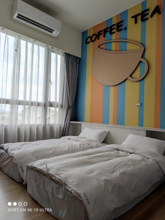 Postel nebo postele na pokoji v ubytování WT BnB Taichung