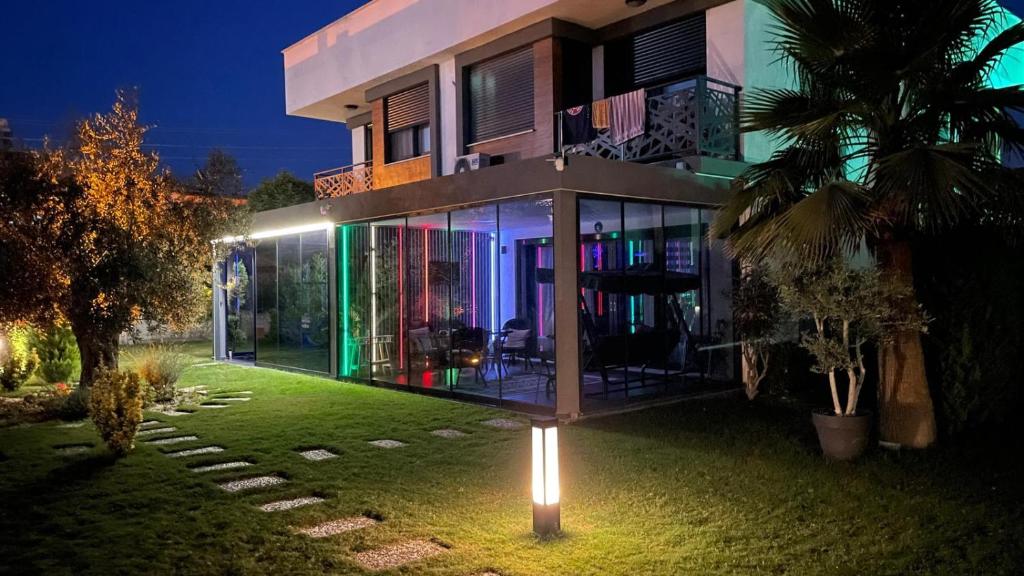 a house with a sign in front of it at night at Traumvilla in Kusadasi in Kuşadası