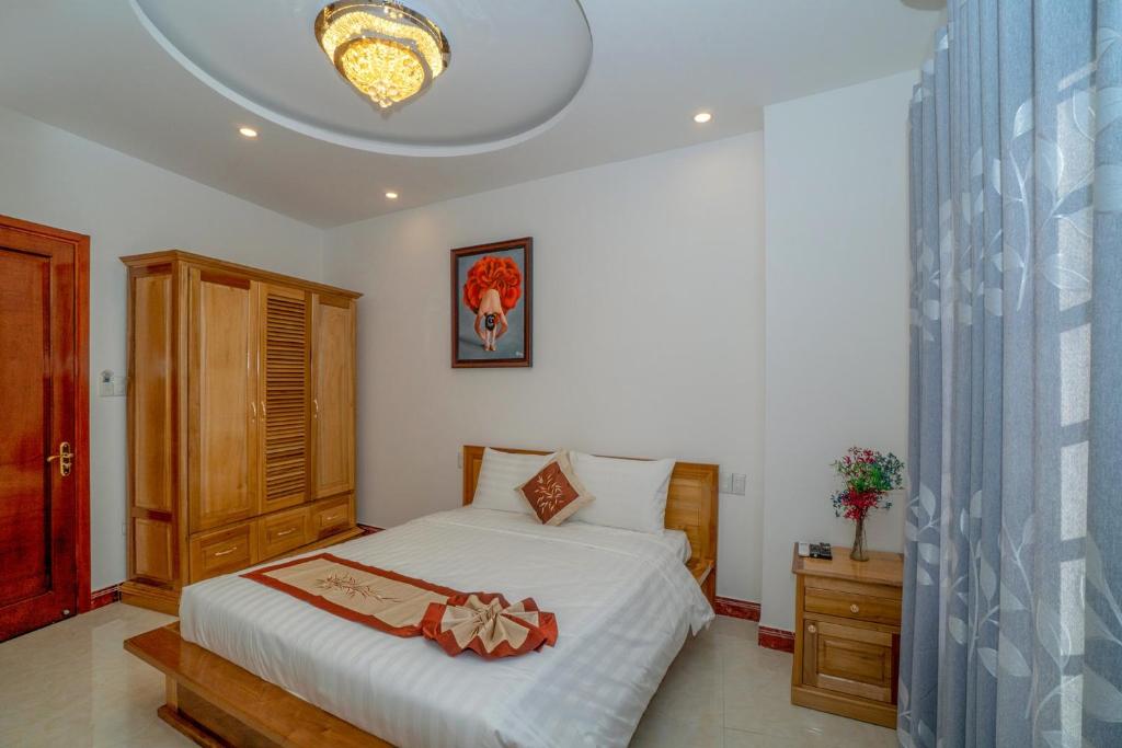 Postel nebo postele na pokoji v ubytování Legend Connect Homestay
