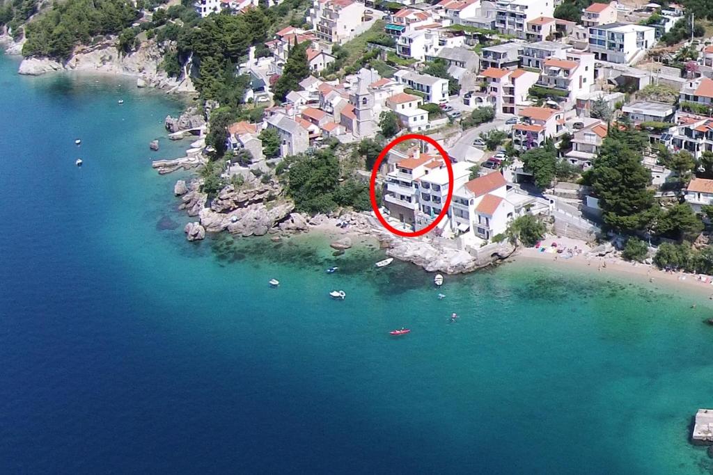 an aerial view of a beach with a sign on it at Apartments by the sea Pisak, Omis - 1018 in Pisak