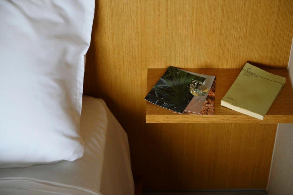 Postel nebo postele na pokoji v ubytování MEGURU l 巡