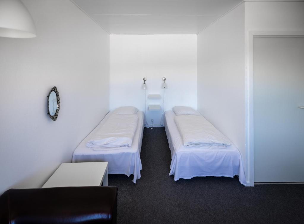 Postel nebo postele na pokoji v ubytování Tylstrup Kro og Motel