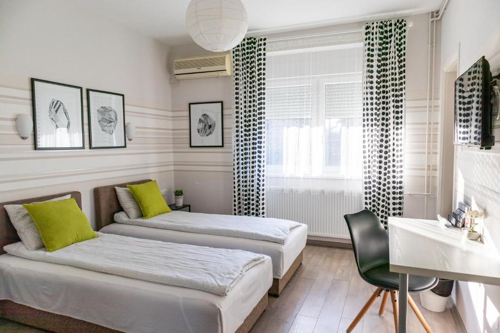 Postel nebo postele na pokoji v ubytování Guest House Family