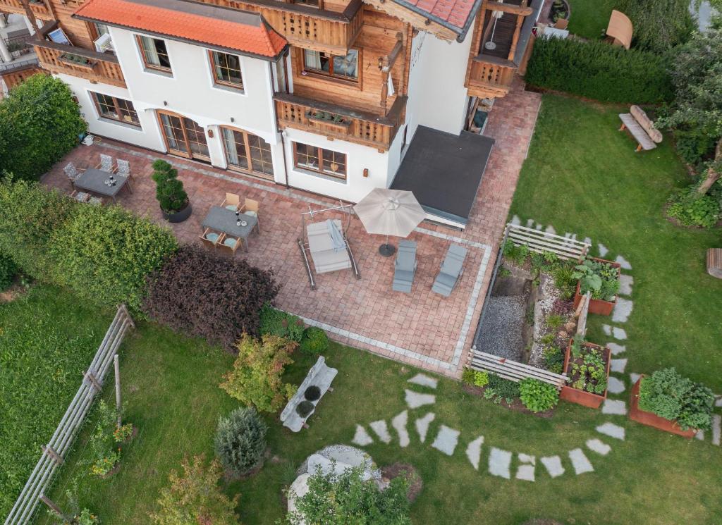 an aerial view of a house with a yard at Wohlfühl Ferien-Heim Aparthotel 4 Sterne in Zell am Ziller