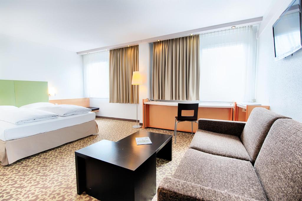 Postel nebo postele na pokoji v ubytování Select Hotel Osnabrueck