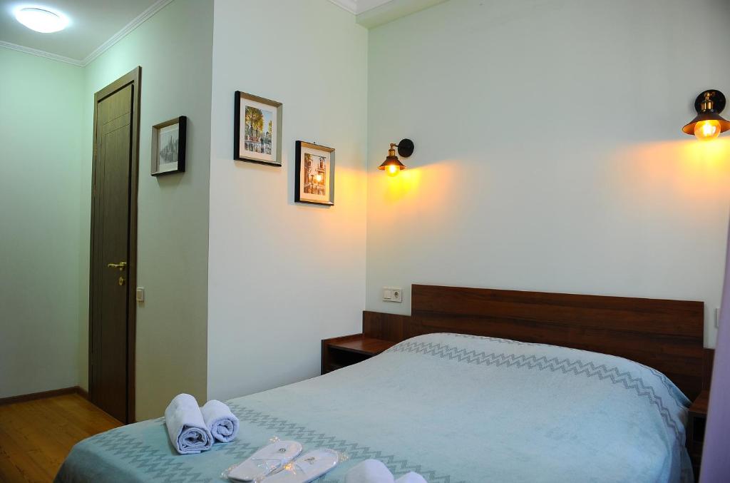 Postel nebo postele na pokoji v ubytování Janika apartments