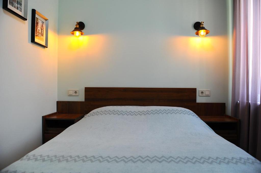 Postel nebo postele na pokoji v ubytování Janika apartments