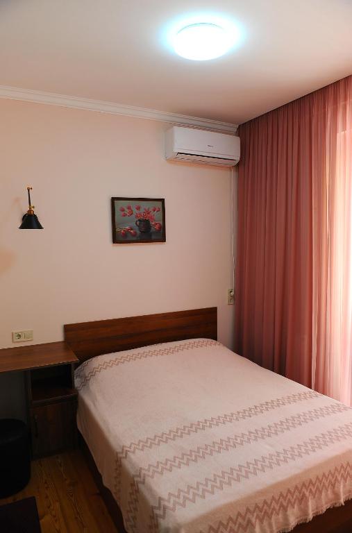 Postel nebo postele na pokoji v ubytování Janika apartments