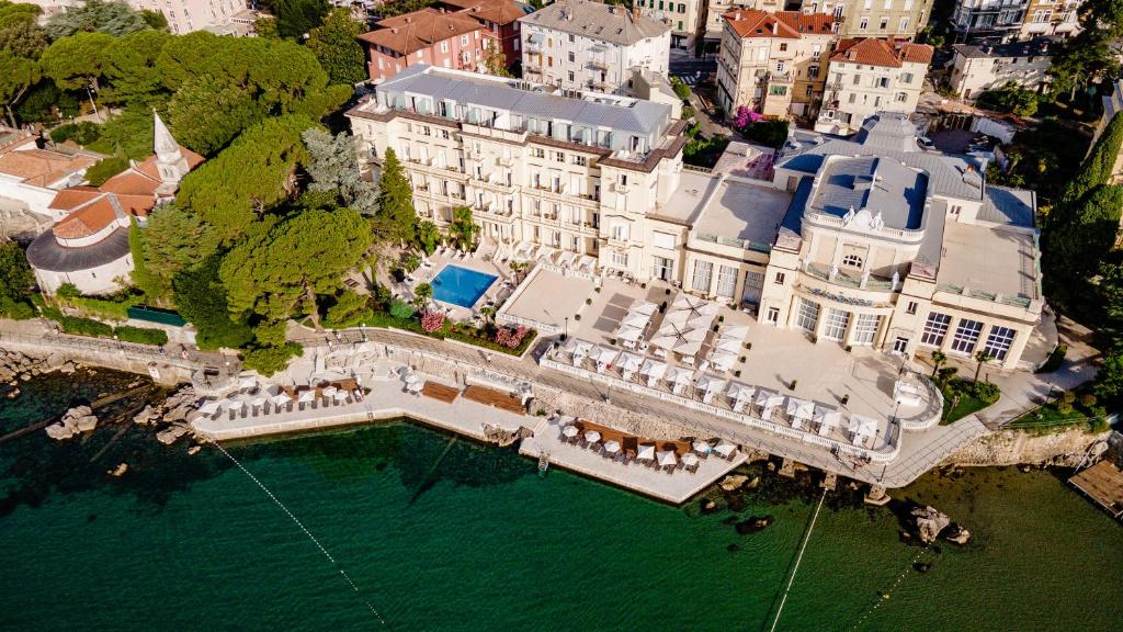 an aerial view of a large house with a pool of water at Hotel Kvarner - Liburnia in Opatija