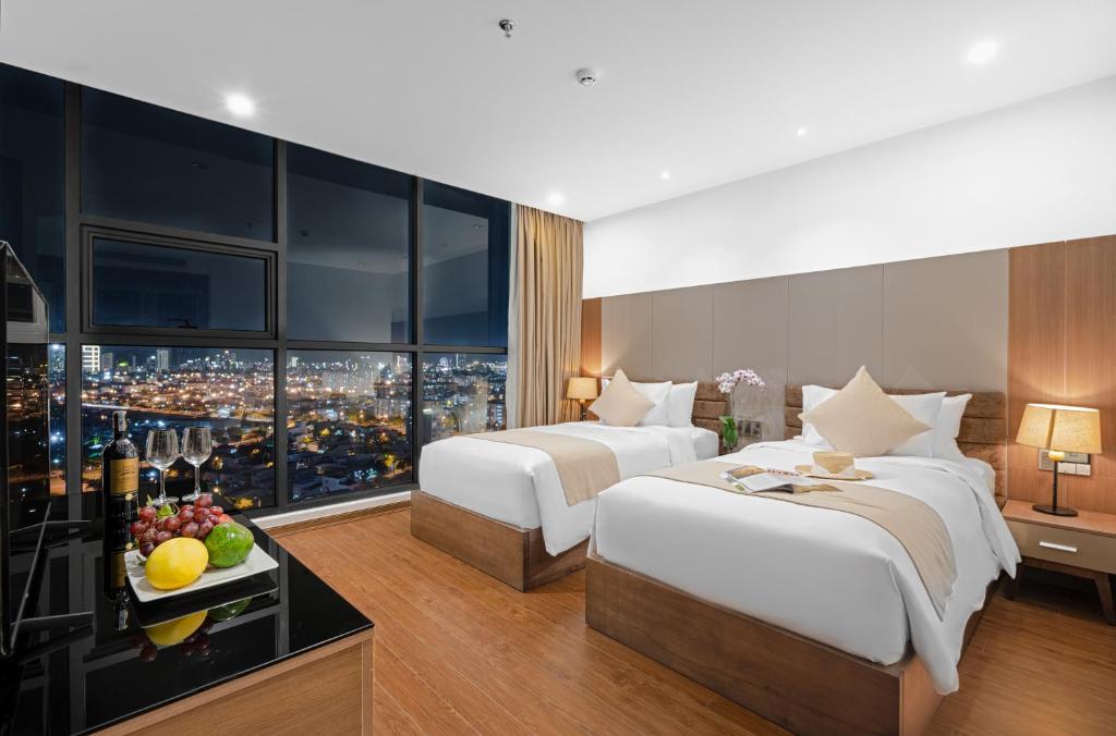 Postel nebo postele na pokoji v ubytování Alan Sea Hotel Danang