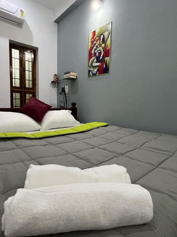 Postel nebo postele na pokoji v ubytování Chez Prabha Homestay