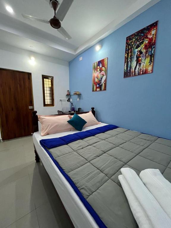 Postel nebo postele na pokoji v ubytování Chez Prabha Homestay