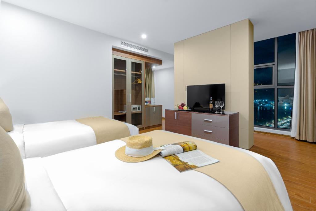 Postel nebo postele na pokoji v ubytování Alan Sea Hotel Danang