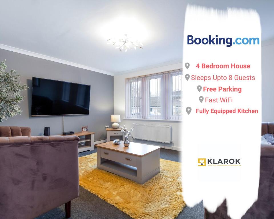 a living room with a couch and a tv at LONG STAYS 30pct OFF - Spacious 4Bed - Sports Channels - Parking By Klarok Short Lets & Serviced Accommodation in Peterborough
