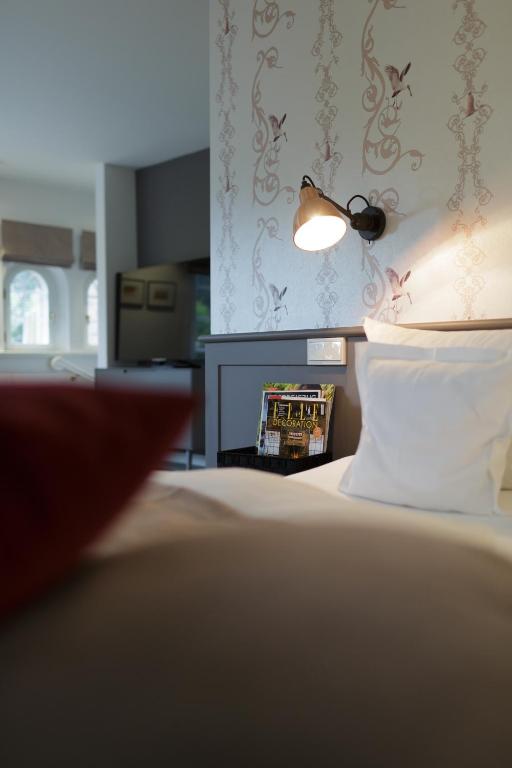 Voodi või voodid majutusasutuse Hotel Aarnhoog toas