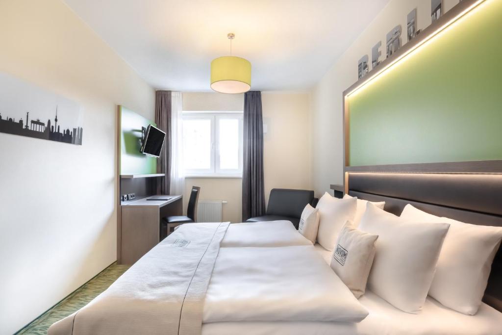 Postel nebo postele na pokoji v ubytování Hotel Aldea Berlin