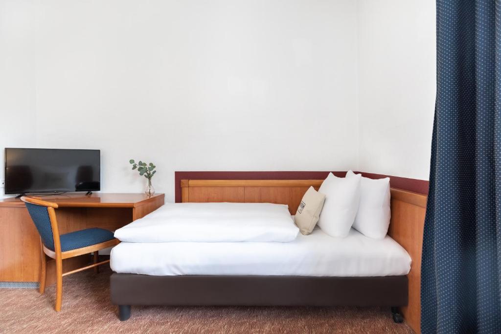 Postel nebo postele na pokoji v ubytování Hotel Aldea Berlin