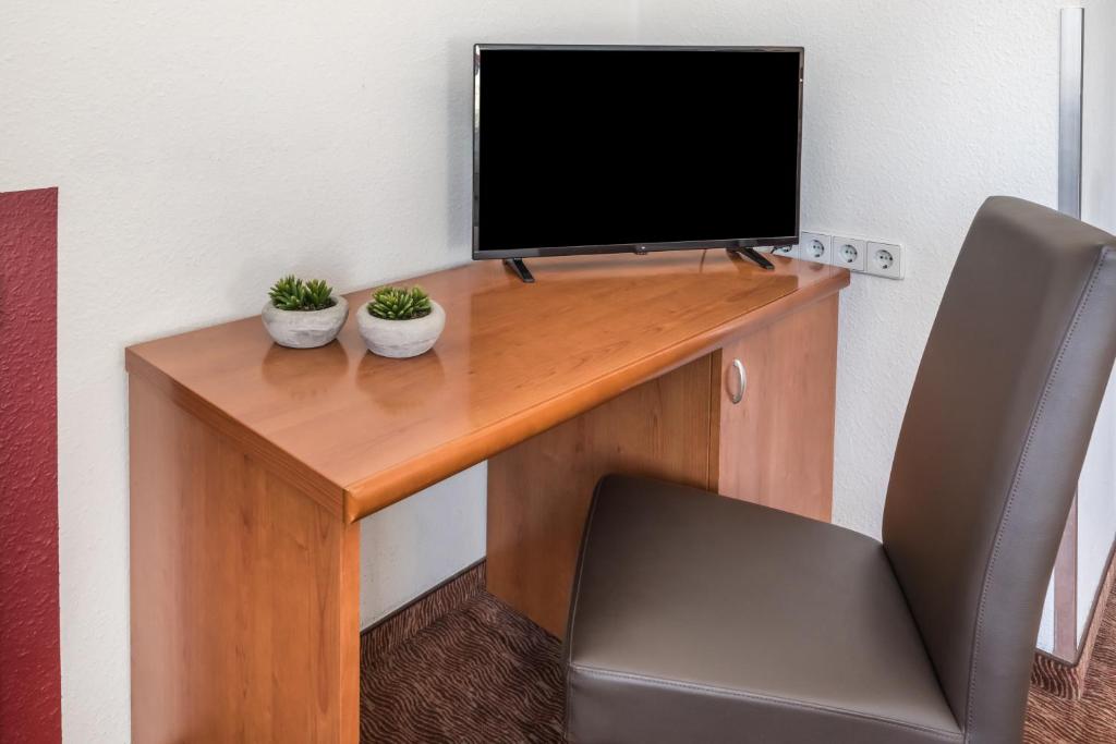 TV a/nebo společenská místnost v ubytování Hotel Aldea Berlin