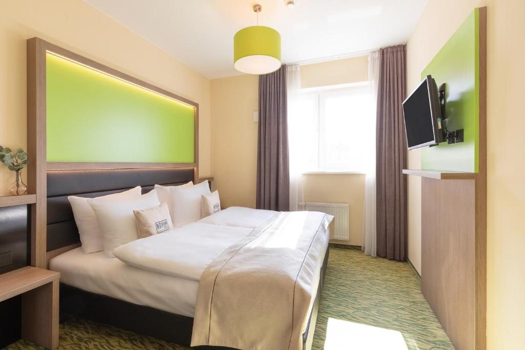 Postel nebo postele na pokoji v ubytování Hotel Aldea Berlin