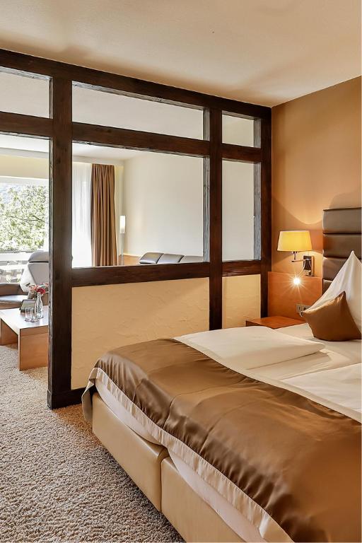 Postel nebo postele na pokoji v ubytování Arens Hotel 327mNN