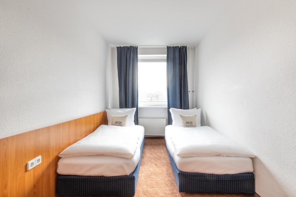 Postel nebo postele na pokoji v ubytování Hotel Aldea Berlin
