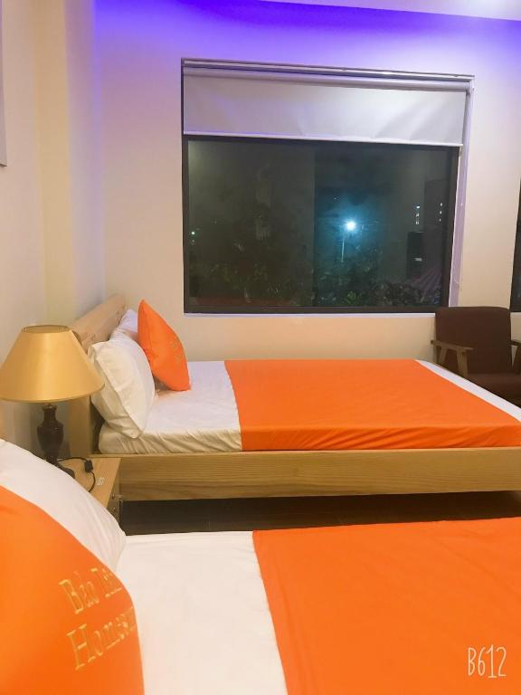 Postel nebo postele na pokoji v ubytování Bao Tran Homestay