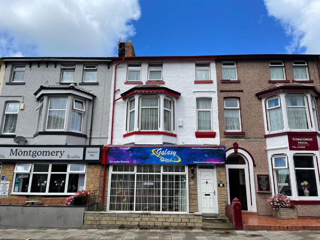 a building on a street with a store at Galaxy Hotel in Blackpool