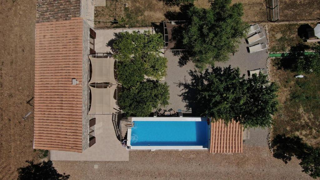 an overhead view of a swimming pool with trees at Ca'n Guiri, Eco Finca in Mallorca in Campanet